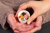 hands-meds-cup